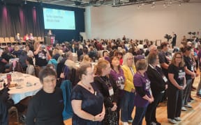 Nurses Organisation delegates turn their back on Health Minister Simeon Brown during his speech to the NZNO conference in Wellington, 17 September 2025.
