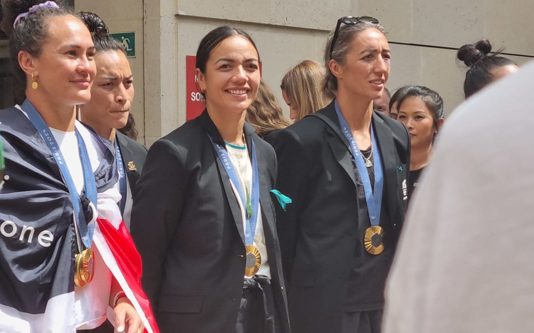 New Zealand Sevens players Portia Woodman-Wickcliffe, Tyla King and Sarah Hirini at New Zealand House in Paris for a gold medal celebration.