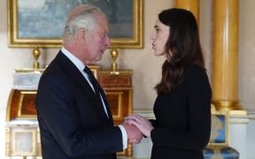 King Charles III meets with New Zealand Prime Minister Jacinda Ardern, during a meeting of Prime Ministers of the Realms, in the 1844 Room in Buckingham Palace in London on September 17, 2022. - Queen Elizabeth's state funeral will take place on September 19, in London's Westminster Abbey, with more than 2,000 guests invited, including heads of state and government from around the world. (Photo by Stefan Rousseau / POOL / AFP)