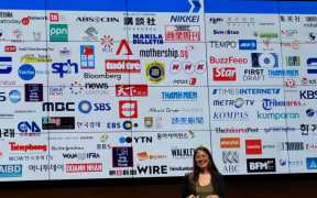 Irene Jay Liu, Google News Lab Asia Pacific in front of logos of media partners.