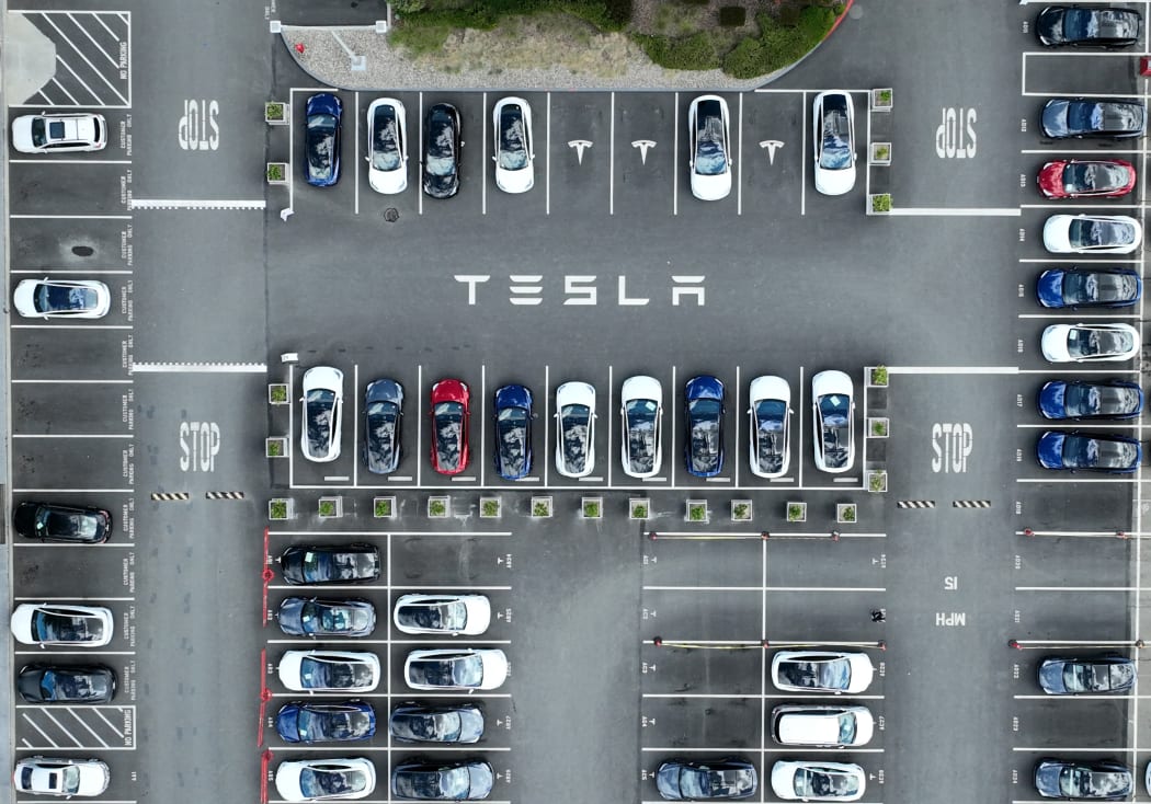 Tesla cars sit parked in a lot at the Tesla factory on April 20, 2022 in Fremont, California.