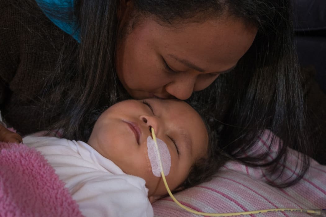 18 month old Moriah with mum Maggie Tu'uinukuafe-Lupeitu'u.  They are appealing against having to return to Tonga where there is limited healthcare available for Moriah.