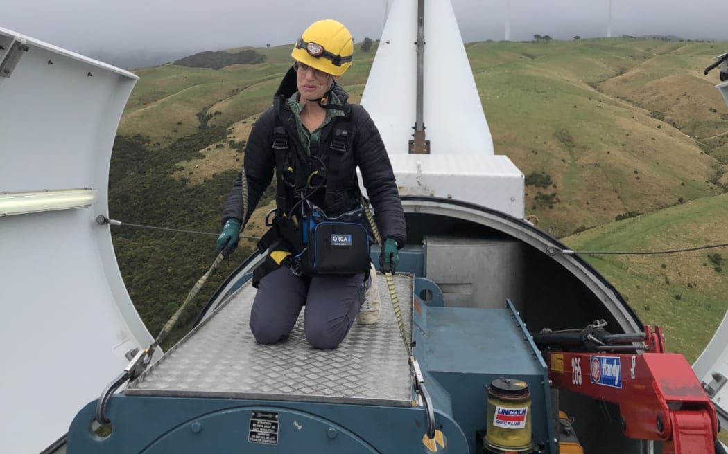 Sharon Brettkelly on top of a wind turbine at West Wind in Makara, Wellington