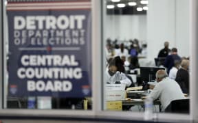Election workers counting absentee ballots for the 2020 general election in Detroit, Michigan.