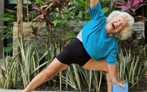 Fitness influencer Joan MacDonald does a yoga pose