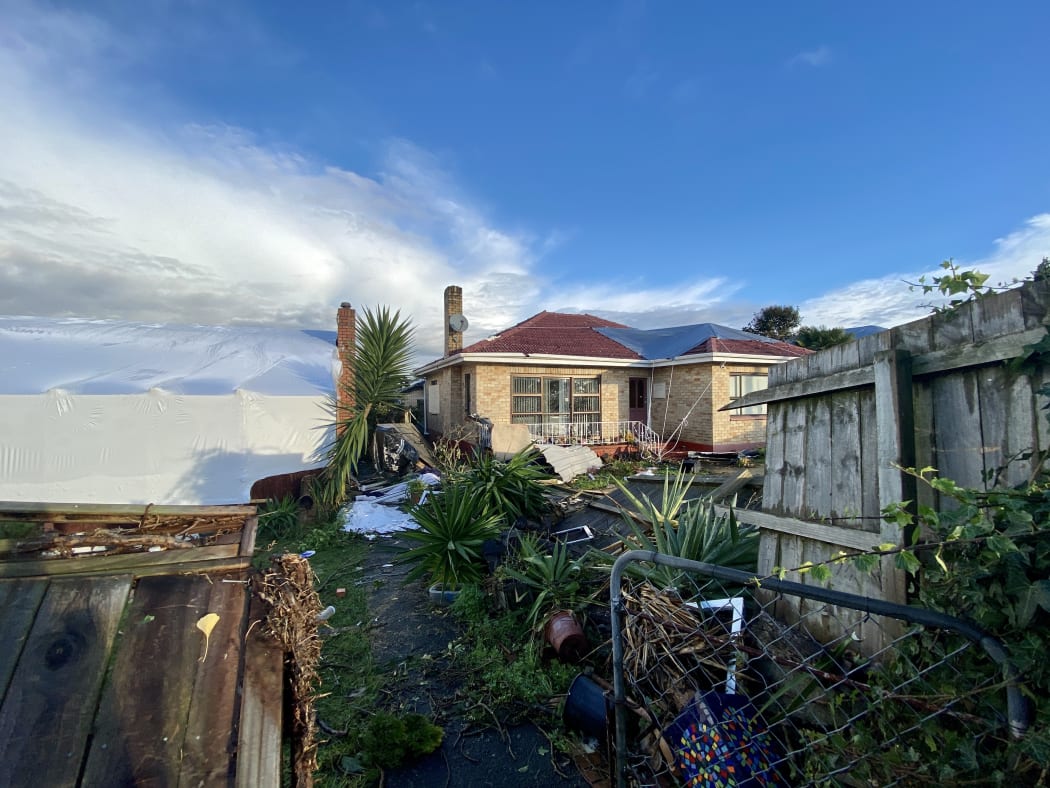 Many houses on Freyberg Avenue are patched up with tarpaulins