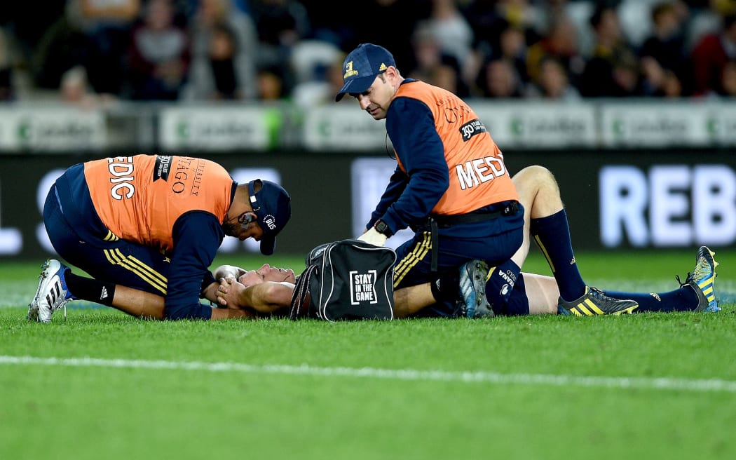 An injured Ben Smith is tended to during the match against the Chiefs.