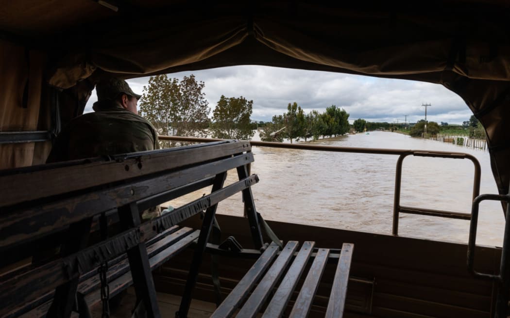 NZ Army Unimog travels through flooded roads near Puketapu, west of Napier, February 16.