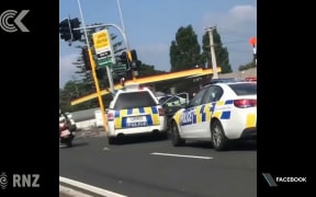 Police shoot at car speeding wrong way down busy road
