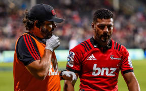 Richie Mo'unga leaves the field after breaking his jaw against the Stormers.
