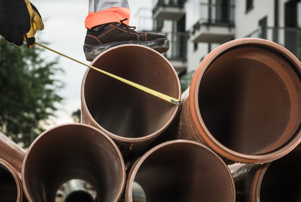 Large Sanitary Pipeline Installation. Construction Industry Theme. Foul Sewer.