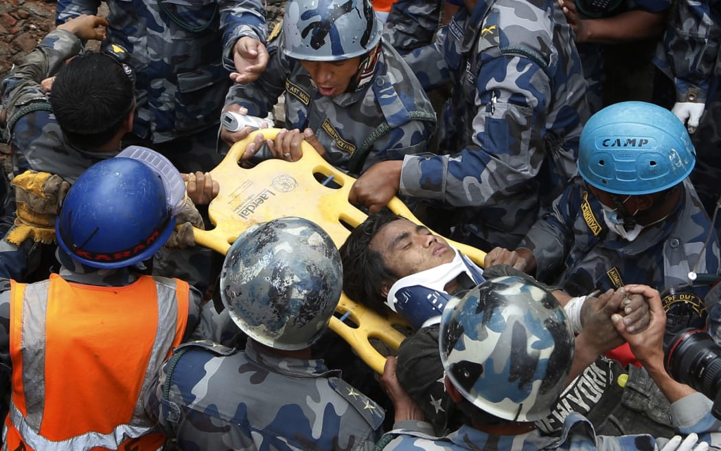 Pemba Tamang is pulled from the rubble of a hotel five days five days after the disastrous earthquake.