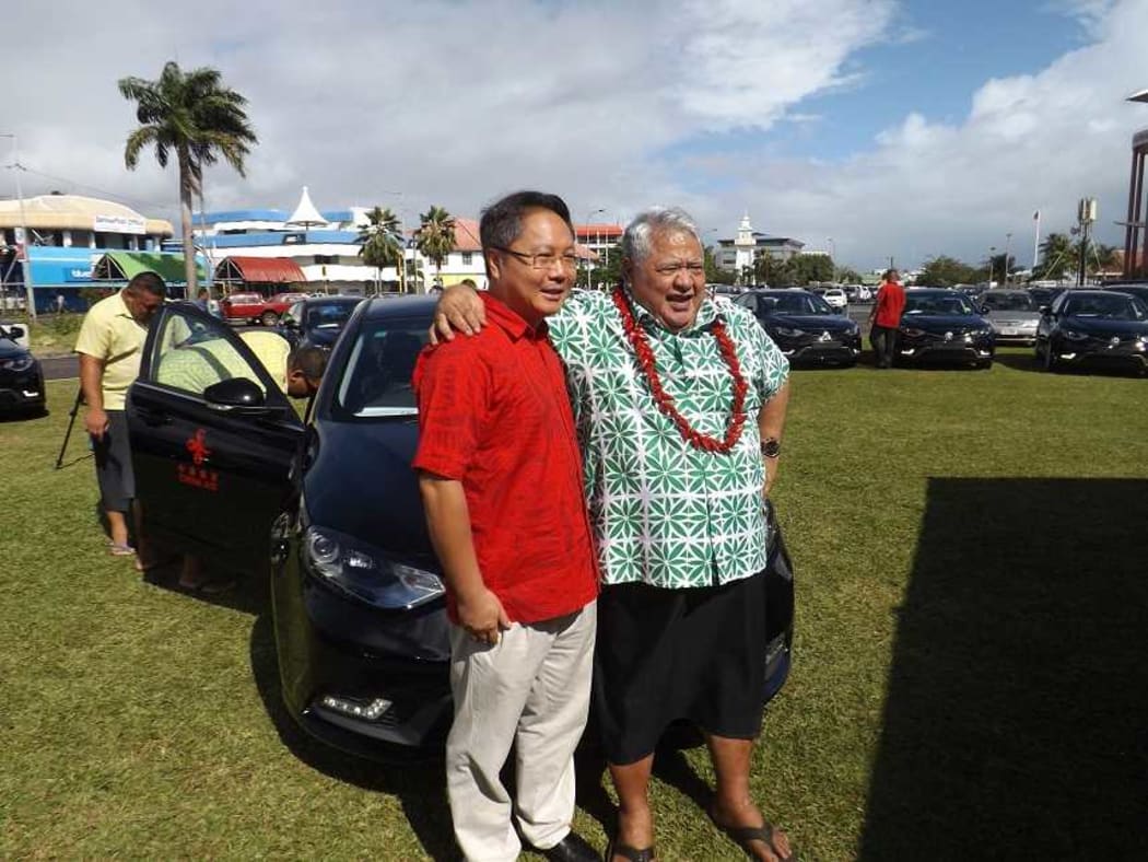 Chinese Ambassador in Samoa Wang Xuefeng and PM Tuila'epa Sa'ilele Malielegaoi at the presentation of 20 brand new Sedan vehicles for the Pacific Island Forum meeting to be hedl in Samoa next week.