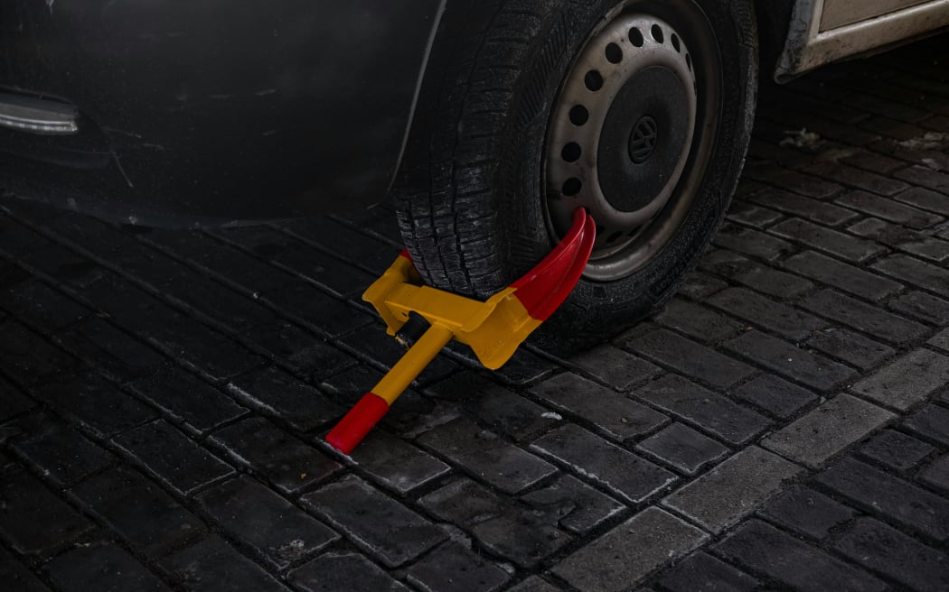A car that has been clamped.