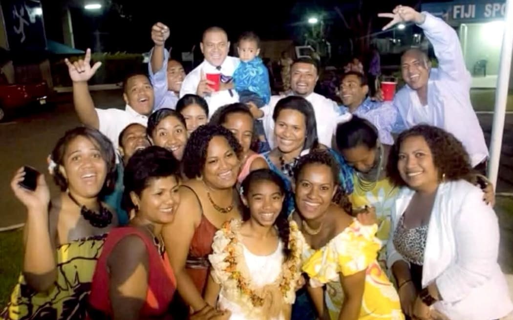 Jone Vakarisi, back-middle, with his family.