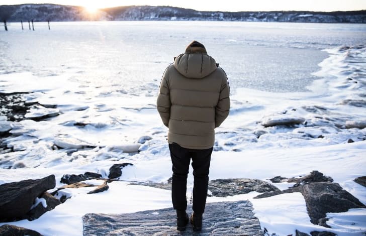 A man stands near the frozen Hudson River on 5 January.