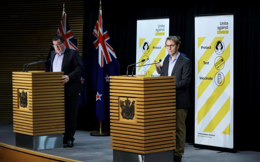 WELLINGTON, NEW ZEALAND - SEPTEMBER 05: Deputy Prime Minister Grant Robertson (L) and Director-General of Health Dr Ashley Bloomfield address media during a press conference at Parliament on September 05, 2021 in Wellington,