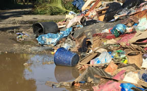 Rubbish piled up after floods in a settlement in Nadi, Fiji
