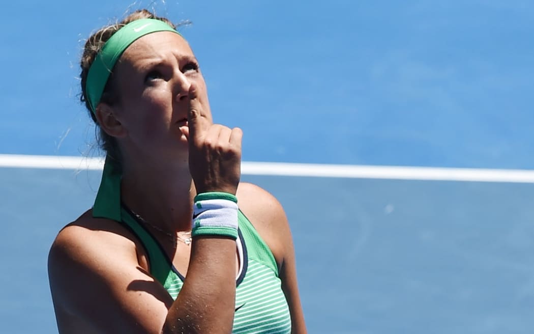 Belarus's Victoria Azarenka gestures after victory in her women's singles match against Czech Republic's Barbora Strycova on day eight of the 2016 Australian Open, January 25, 2016. AFP PHOTO / GREG WOOD