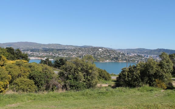 The view looking west at the rear access point to the prison: Evans Bay and Matairangi.