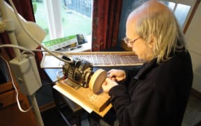 Auckland harpsichord maker and technician Paul Downie working painstakingly on some of the 305 jacks of The Beast.