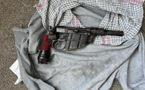 Police in Rotorua seized two firearms, MDMA, and $30,000 cash after carrying out several searches as part of Operation Denim on 11 December, 2023.