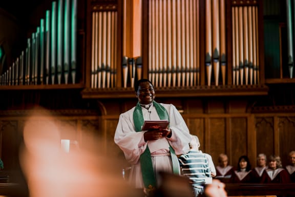 Amos Muzondiwa in church where he works at a pastor in Ōwairaka, Auckland.