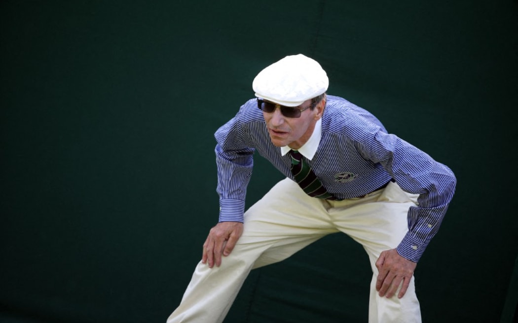 A line judge keeps position during the men's singles first round match between France's Nicolas Mahut and Spain's Marcel Granollers on day two of the 2014 Wimbledon Championships at The All England Tennis Club in Wimbledon, southwest London, on June 24, 2014.