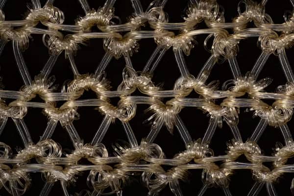 The weave of nylon stockings under a microscope shows how the threads are much smoother and more crystalline than natural fibres.