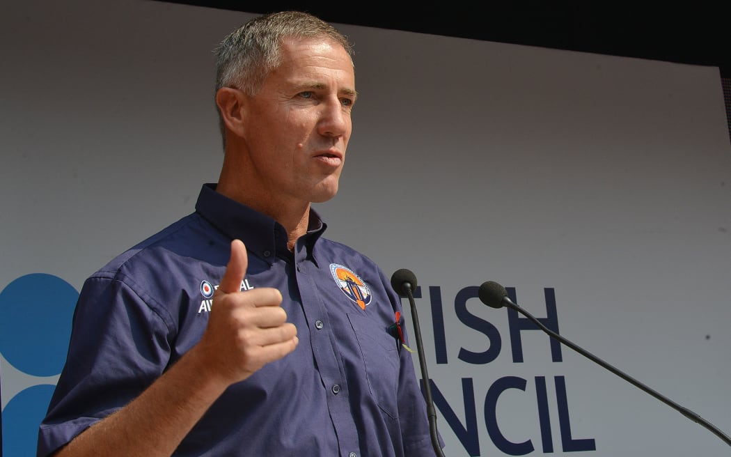 Andy Green with a model of the Bloodhound SSC (Supersonic Car) at its unveiling in New Delhi.