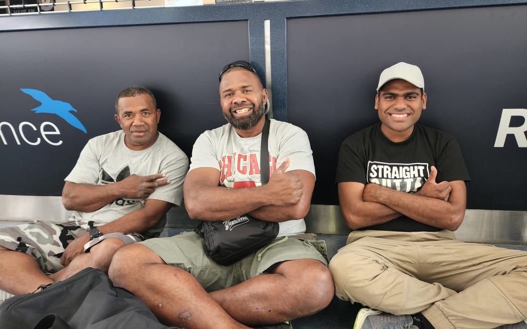 Travellers at Auckland Airport before their flight.
