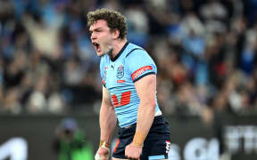 Liam Martin of the Blues reacts after scoring a try during the State of Origin Game Two in Melbourne, 2024.