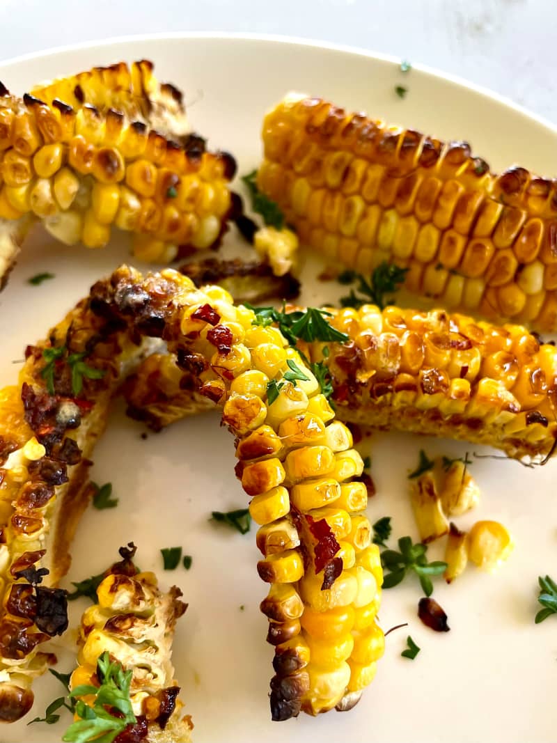 Roasted sweetcorn ribs with chilli-honey butter.