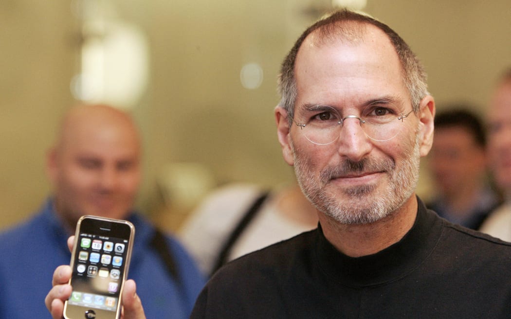 Apple co-founder Steve Jobs attends a press conference in central London, 18 September 2007 after the release of the first iPhone.