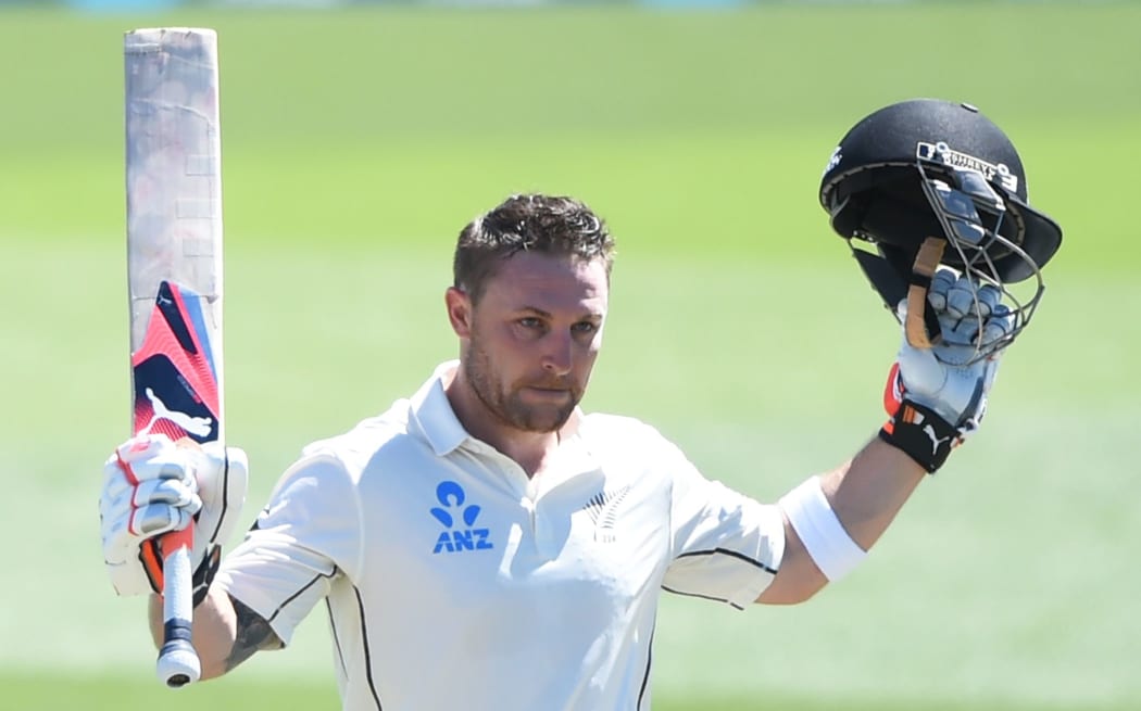 Brendon McCullum celebrates a world record test century.