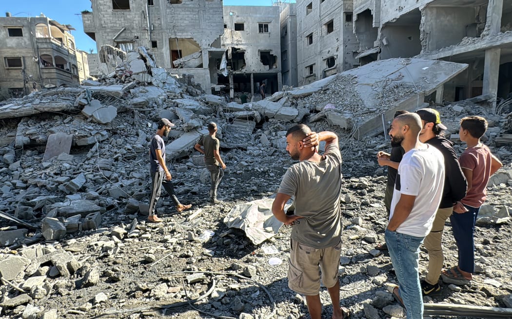 Palestinians inspect the damage after an Israeli airstrike the previous night in Beit Lahia, in the northern Gaza Strip on October 20, 2024, amid the ongoing conflict between Israel and the Palestinian Hamas militant group. (Photo by Islam AHMED / AFP) / “The erroneous mention[s] appearing in the metadata of this photo by Islam AHMED has been modified in AFP systems in the following manner: [October 20] instead of [October 19]. Please immediately remove the erroneous mention[s] from all your online services and delete it (them) from your servers. If you have been authorized by AFP to distribute it (them) to third parties, please ensure that the same actions are carried out by them. Failure to promptly comply with these instructions will entail liability on your part for any continued or post notification usage. Therefore we thank you very much for all your attention and prompt action. We are sorry for the inconvenience this notification may cause and remain at your disposal for any further information you...