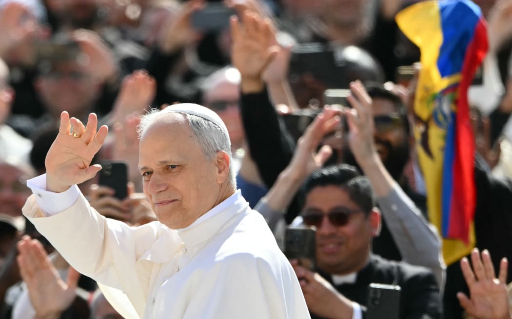 Pope Leo XIV greets the crowd from the popemobile before a Holy mass for the beginning of his pontificate, in St Peter's square in The Vatican on May 18, 2025. (Photo by Alberto PIZZOLI / AFP)