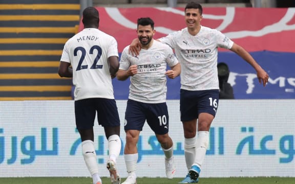 Manchester City's Argentinian striker Sergio Aguero (C) celebrates scoring his team's first goal with teammates during the English Premier League football match against Crystal Palace and Manchester City at Selhurst Park in south London on May 1, 2021.