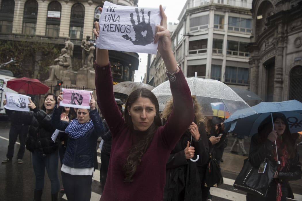 Women in Buenos Aires protest on "Black Wednesday" after teenager Lucia Perez was brutally raped and murdered.
