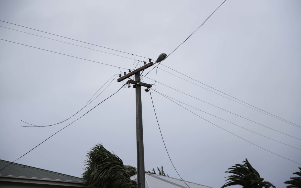 Powerlines down on Brougham St in Westport, live wires being cleared from the footpath.