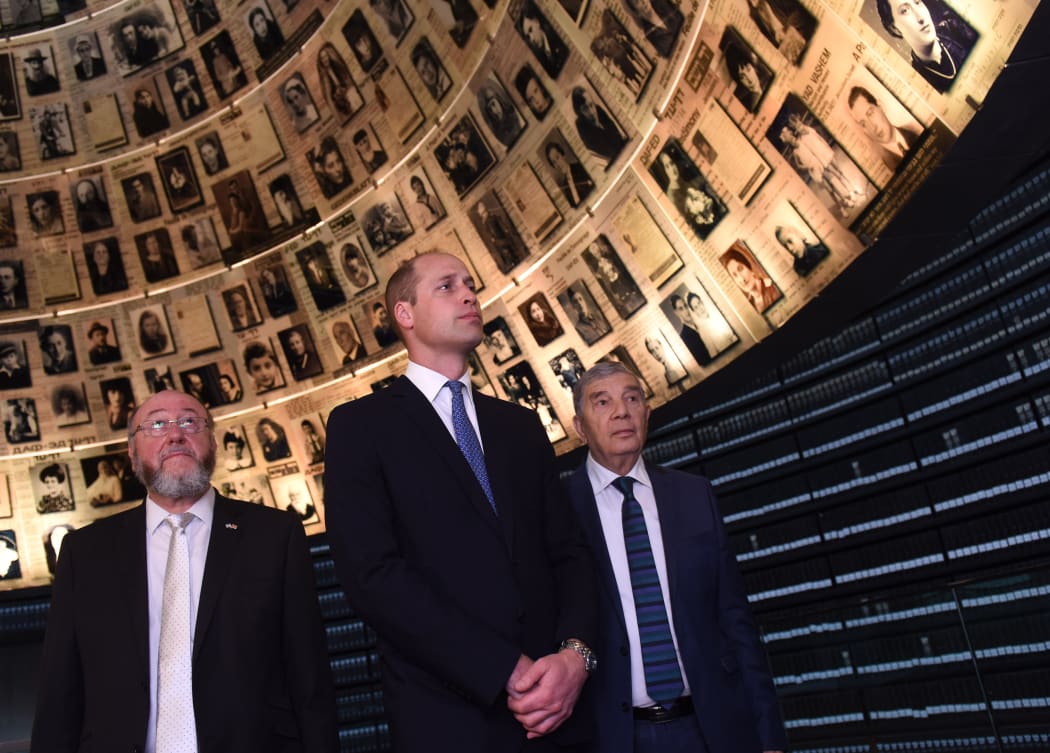 Britain's Prince William, Chief Rabbi Ephraim Mirvis of the United Congregations of the Commonwealth (L) and chairman of Yad Vashem Avner Shalev, tour the Yad Vashem Holocaust memorial in Jerusalem on 26 June, 2018.
