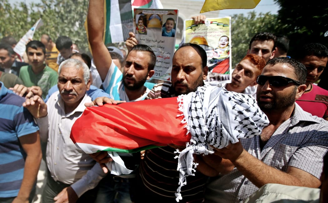 Anger at the funeral of 18-month-old Ali Saad Dawabsha.