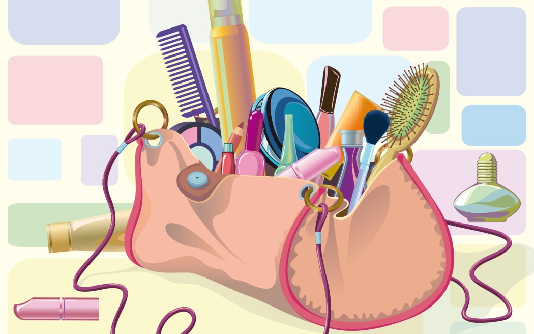 Handbag filled with objects of his care and cosmetics.