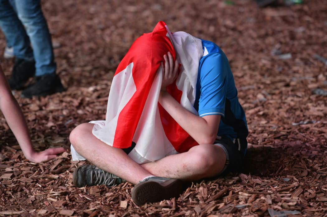 England's fans are disappointed after the football match between Iceland and England at the Champ-de-Mars fan zone in Paris on 27 June 2016.