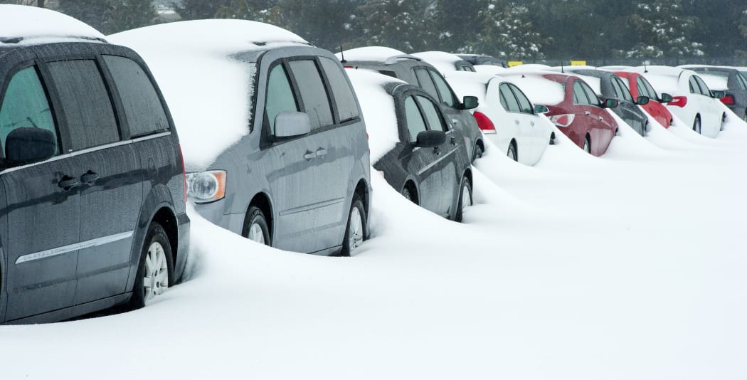 Rental cars covered with snow at Dulles international airport in Virginia.