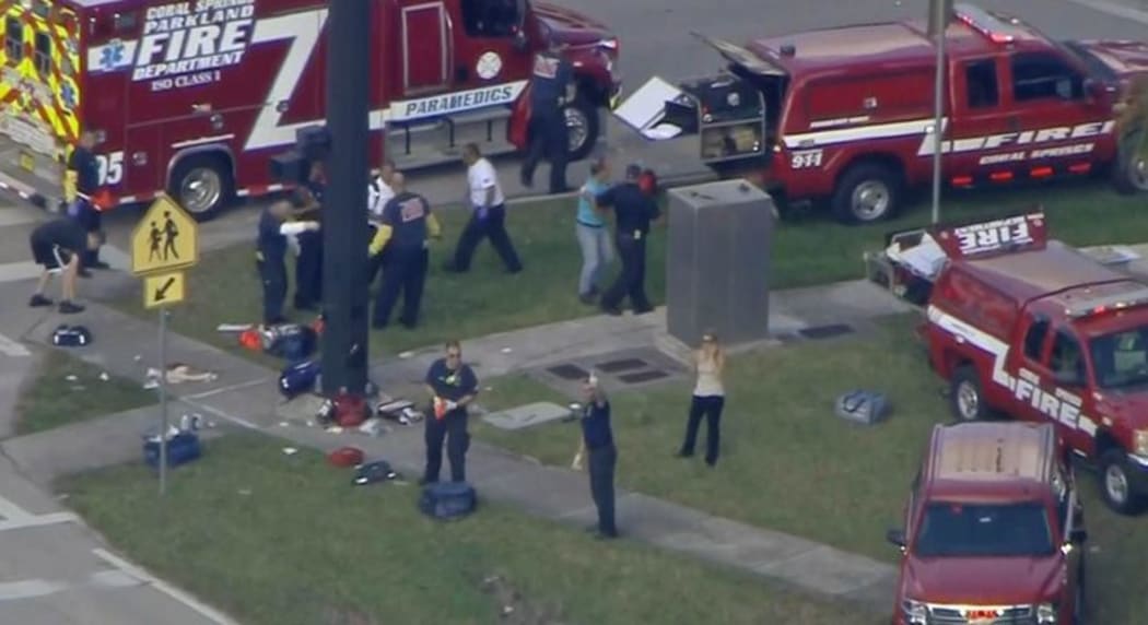 Emergency services attend the shooting in the town of Parkland in Broward County, Florida.