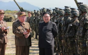 This undated photo released by North Korea's official Korean Central News Agency (KCNA) on August 26, 2017 shows North Korean leader Kim Jong-Un presiding over a target strike exercise conducted by the special operation forces of the Korean People's Army (KPA) at an undisclosed location.