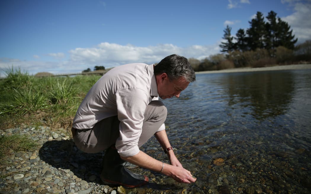 Ian Telfer checks out the Oreti River, after Prime Minister Bill English said he would still swim in it.