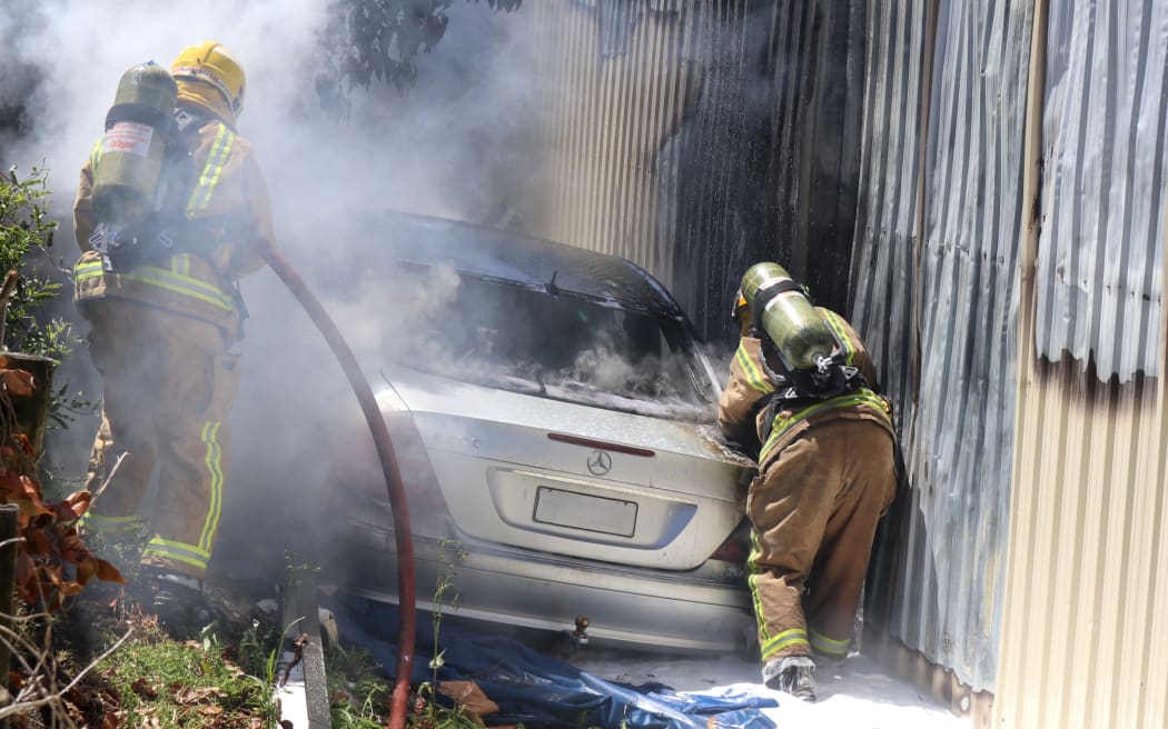 Kerikeri volunteer firefighters battle a major blaze at The Music Workshop on Waipapa Road on 24 October 2017.