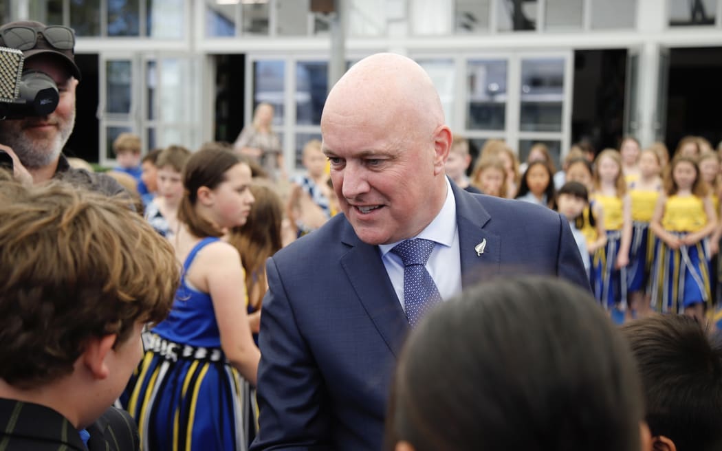 Christopher Luxon talks to pupils at a school visit in Auckland, shortly after the 2023 election.